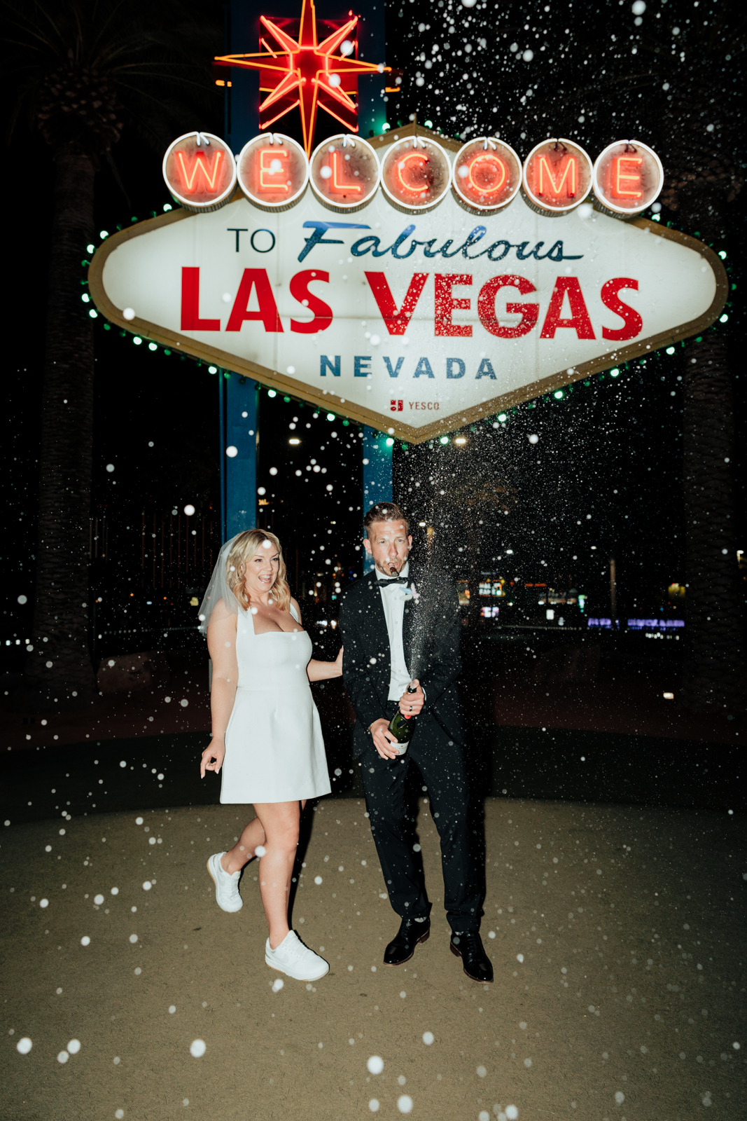 Wedding couple and Welcome to Las Vegas Sign