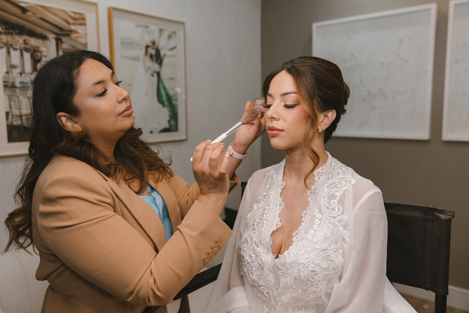 Bride getting her makeup done on the big day of her Dragonridge wedding